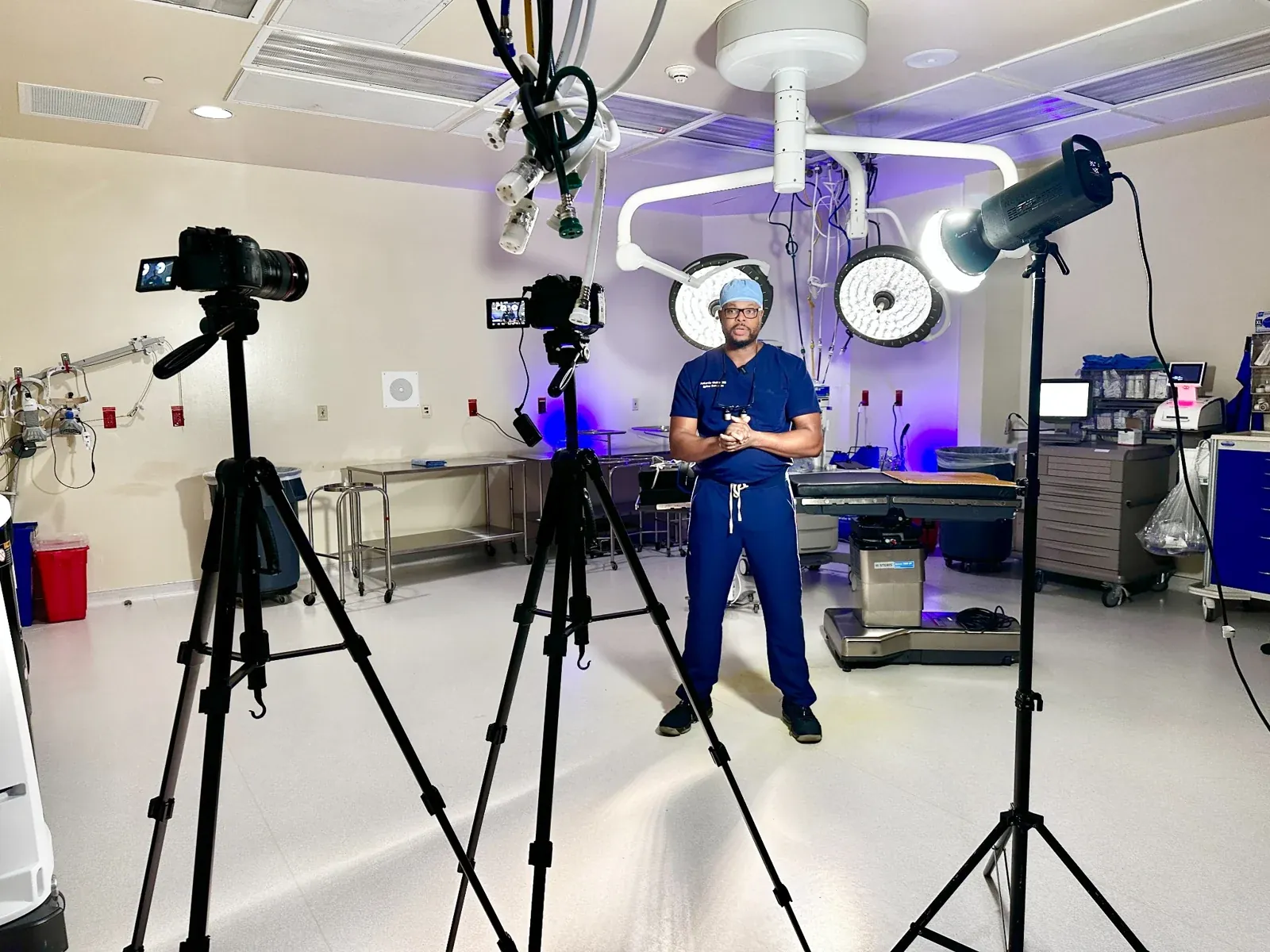 Crew filming Dr. Antonio Webb in an operating room